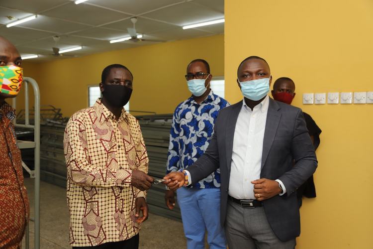 Mr Nelson Owusu Ansah DCEOP handing  over a 300-bed capacity dormitory to the Authorities of the Youth Leadership and Skills Training Institute at Abura in the Western Region 